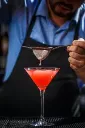 barman-makes-cosmopolitan-cocktail-200x300.webp